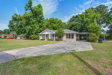 Welcome to this charming 3-bedroom brick ranch nestled on a - photo 2