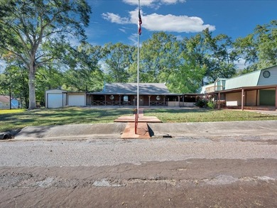 This lake property is special, featuring multiple living - photo 2