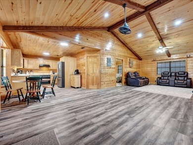 This lake property is special, featuring multiple living - photo 5