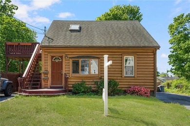 Unique two-family log cabin in the desirable Riverside area - photo 1