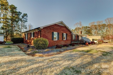 This spacious brick ranch is located on a lovely lot in a quiet