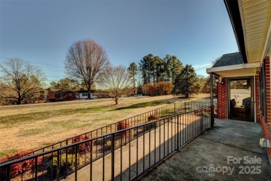 This spacious brick ranch is located on a lovely lot in a quiet