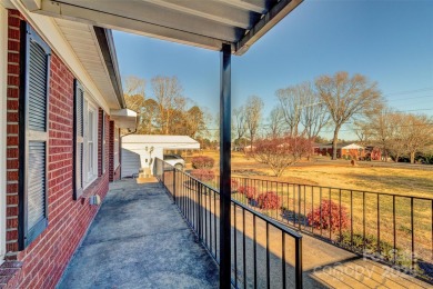 This spacious brick ranch is located on a lovely lot in a quiet