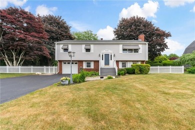 Discover the potential of this raised ranch located in the - photo 1