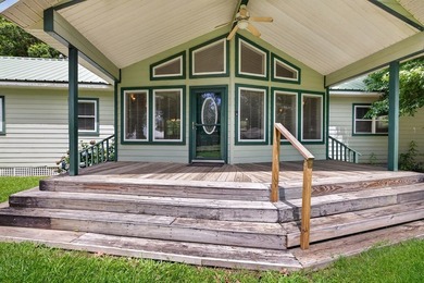 Located on a spacious corner lot, this waterfront 3-bedroom - photo 3