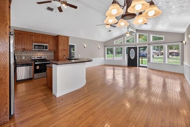 Located on a spacious corner lot, this waterfront 3-bedroom - photo 9