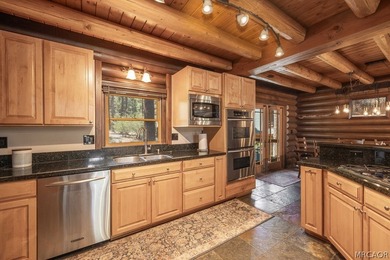 Nestled among the pines on a beautifully wooded acre, this - photo 11