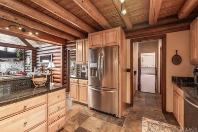 Nestled among the pines on a beautifully wooded acre, this - photo 12