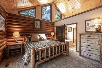 Nestled among the pines on a beautifully wooded acre, this - photo 15