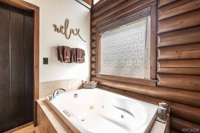Nestled among the pines on a beautifully wooded acre, this - photo 18