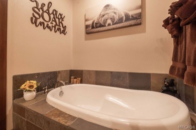 Nestled among the pines on a beautifully wooded acre, this - photo 23