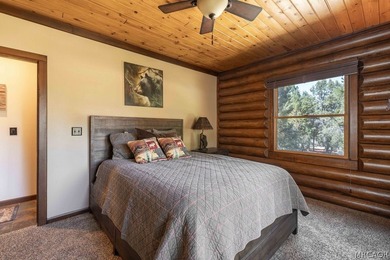 Nestled among the pines on a beautifully wooded acre, this - photo 25
