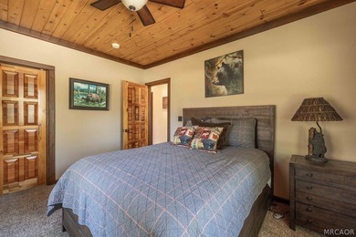 Nestled among the pines on a beautifully wooded acre, this - photo 26