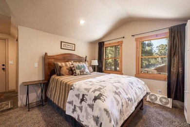 Nestled among the pines on a beautifully wooded acre, this - photo 32