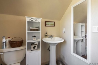 Nestled among the pines on a beautifully wooded acre, this - photo 35