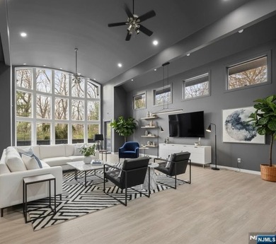 Welcome to this striking, fully-renovated modern masterpiece set - photo 2