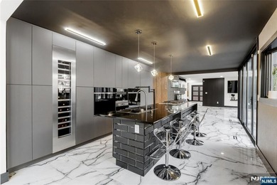 Welcome to this striking, fully-renovated modern masterpiece set - photo 3