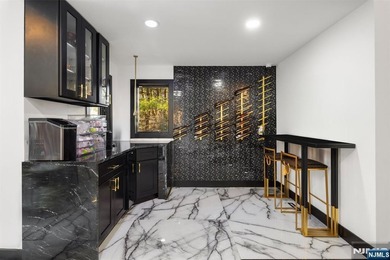 Welcome to this striking, fully-renovated modern masterpiece set - photo 7