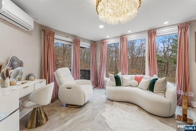 Welcome to this striking, fully-renovated modern masterpiece set - photo 10