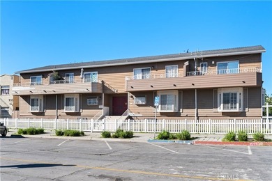 This two-story, townhouse-style condominium offers two primary - photo 1