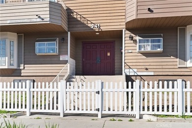 This two-story, townhouse-style condominium offers two primary - photo 2