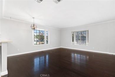 This two-story, townhouse-style condominium offers two primary - photo 3