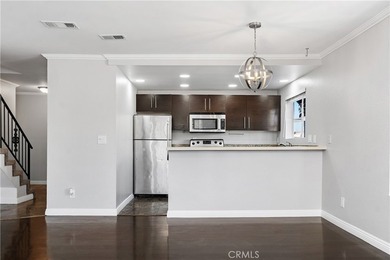 This two-story, townhouse-style condominium offers two primary - photo 7
