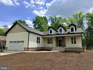 Nestled in the prestigious Lake of the Woods community, this - photo 1