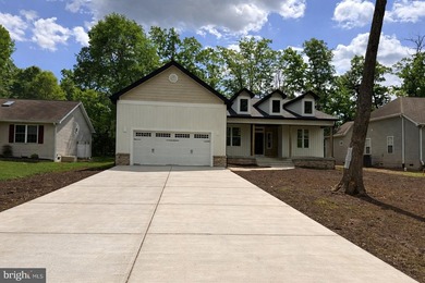 Nestled in the prestigious Lake of the Woods community, this - photo 2