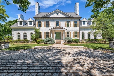 Tucked at the end of a tree-lined drive on a secluded acre, this - photo 1