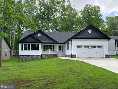 Nestled in the prestigious Lake of the Woods community, this - photo 1