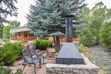Beautiful property along the Red River in Questa NM! The - photo 2