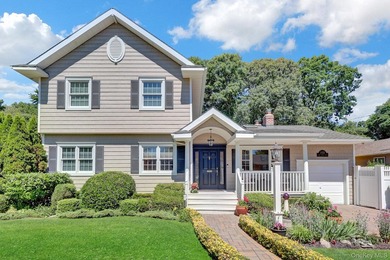 Welcome to this beautifully expanded ranch nestled in one of the - photo 1