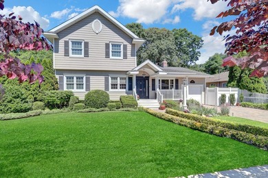 Welcome to this beautifully expanded ranch nestled in one of the - photo 2