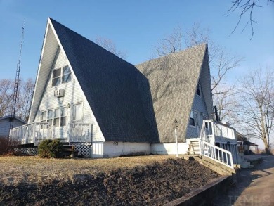 Attractive A-frame with wood vaulted ceilings and charming - Lake Home For Sale in Culver, Indiana