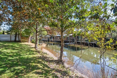 75' of canal frontage sets the stage for easy waterfront living - photo 31