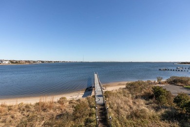 Set on 175 feet of private sandy beachfront with a 136' dock - photo 5