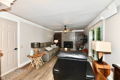 Tucked away on a quiet lot that COMBINES a spacious lawn with a - photo 17