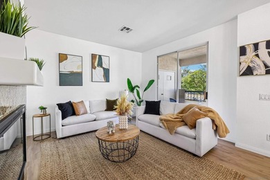 Motivated Seller!! This light and bright top floor condo is - photo 1