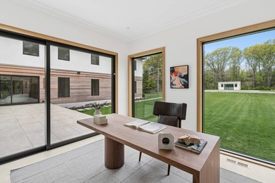 A newly built modern showpiece with sweeping bay and pond views - photo 11