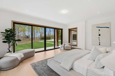 A newly built modern showpiece with sweeping bay and pond views - photo 12
