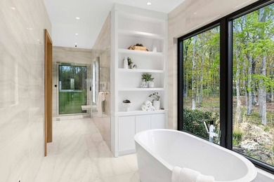 A newly built modern showpiece with sweeping bay and pond views - photo 13