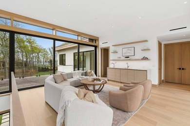 A newly built modern showpiece with sweeping bay and pond views - photo 15