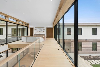 A newly built modern showpiece with sweeping bay and pond views - photo 17