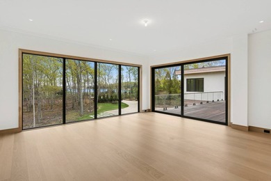 A newly built modern showpiece with sweeping bay and pond views - photo 18