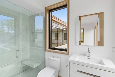 A newly built modern showpiece with sweeping bay and pond views - photo 19