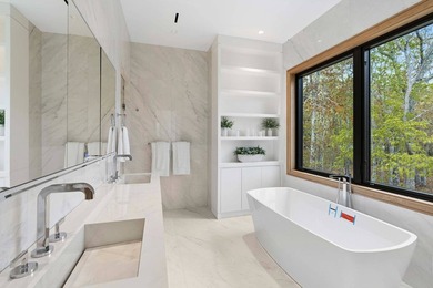 A newly built modern showpiece with sweeping bay and pond views - photo 21