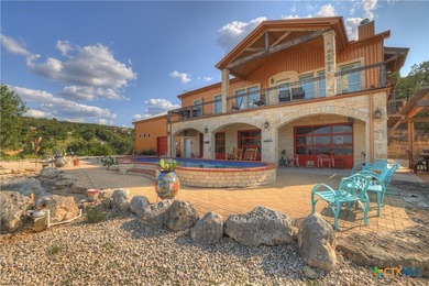 Set on more than six private acres overlooking Canyon Lake, this - photo 1