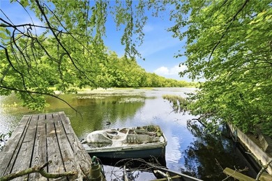 Set on nearly an acre in North Kingstown, this 3-bedroom, 1-bath - photo 6