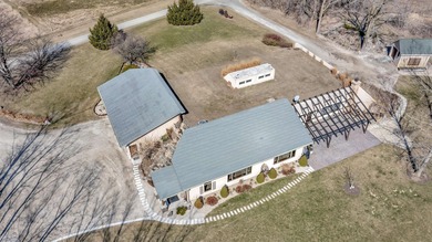 This unique 15 acre earth home situated just south of the city